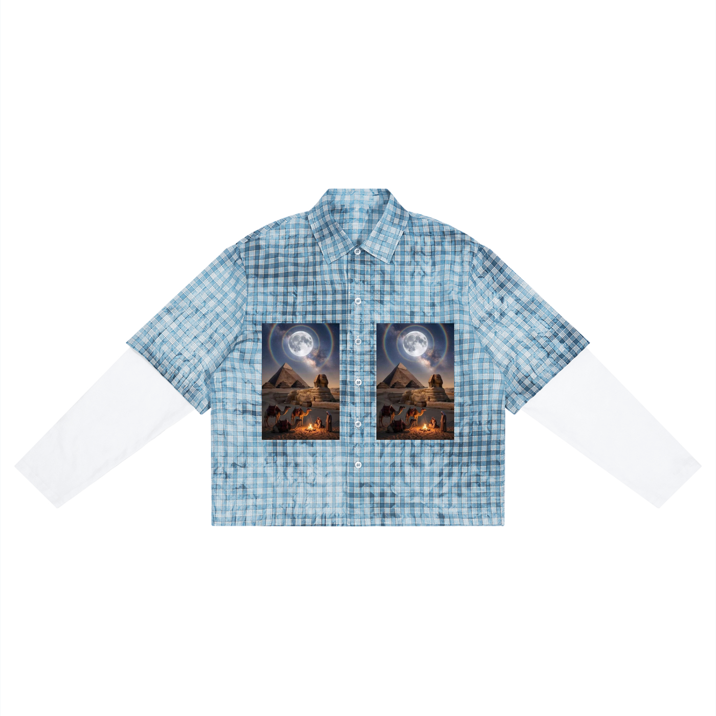 A short-sleeve button-up shirt with a light blue and white gingham pattern, featuring two rectangular graphic prints on the chest depicting a desert landscape under a full moon.