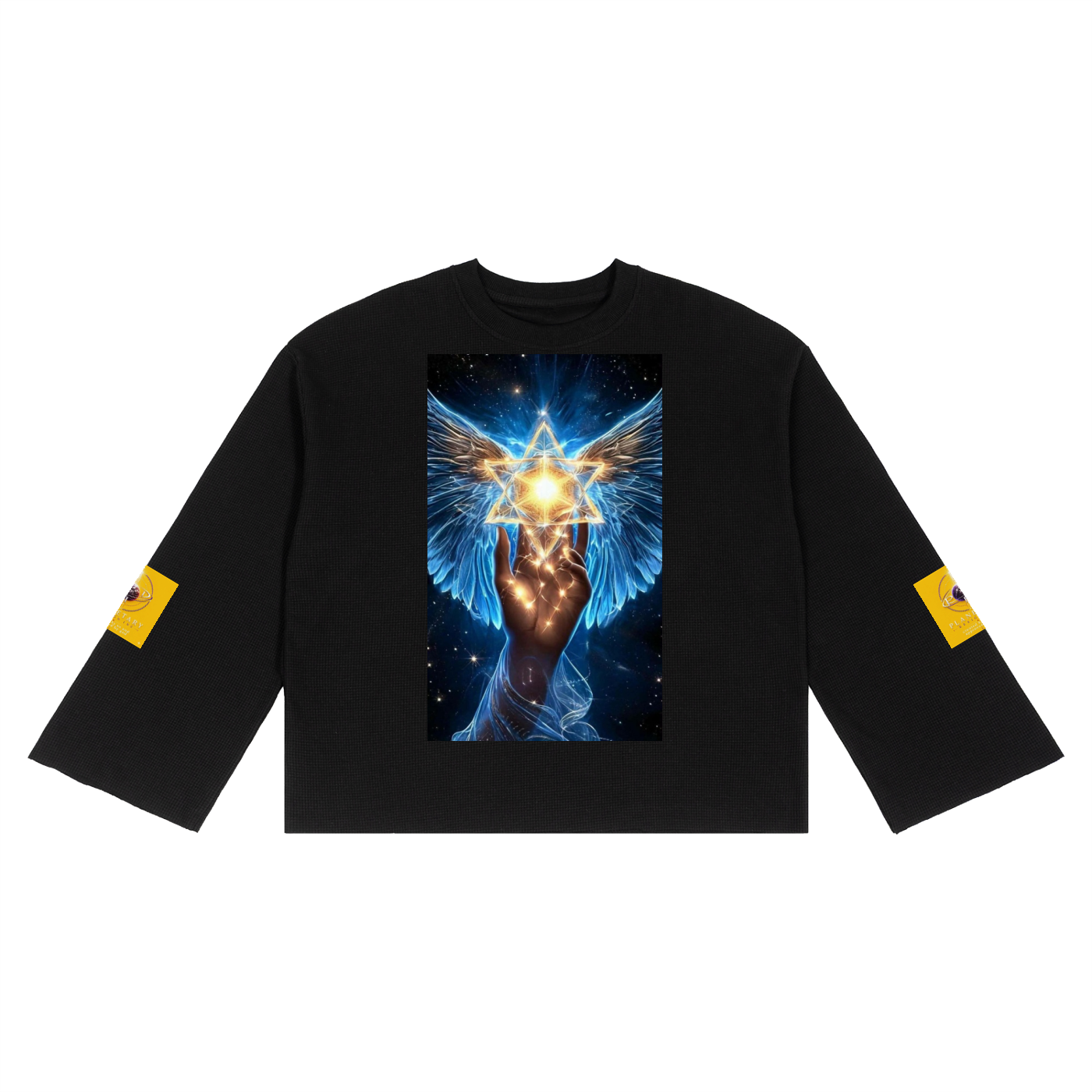 A black long-sleeve crop top featuring a large graphic print on the chest of a winged hand holding a glowing golden Star of David against a starry blue background. Each sleeve has a small yellow graphic patch near the cuff.
