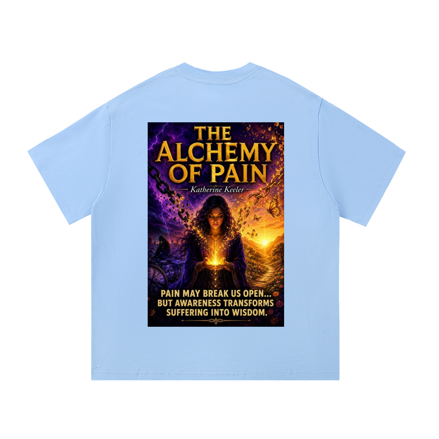 Light blue t-shirt with a graphic of 'The Alchemy of Pain' book cover on the back.