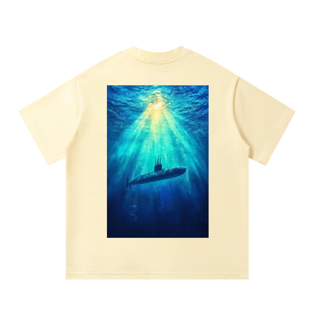 Beige t-shirt with a submarine graphic on a white background