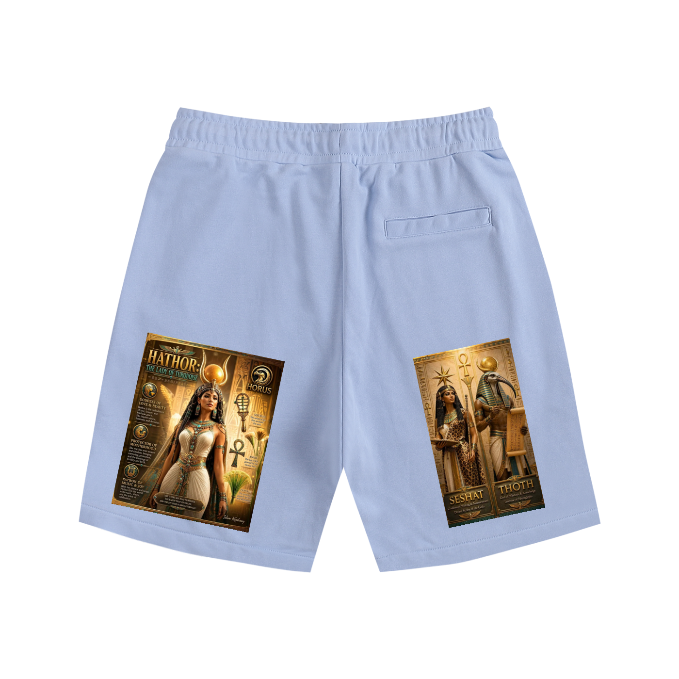 Light blue athletic shorts with a back pocket, featuring large graphic prints on both legs depicting Egyptian-themed illustrations labeled 'Hathor' and 'Sekhmet'.