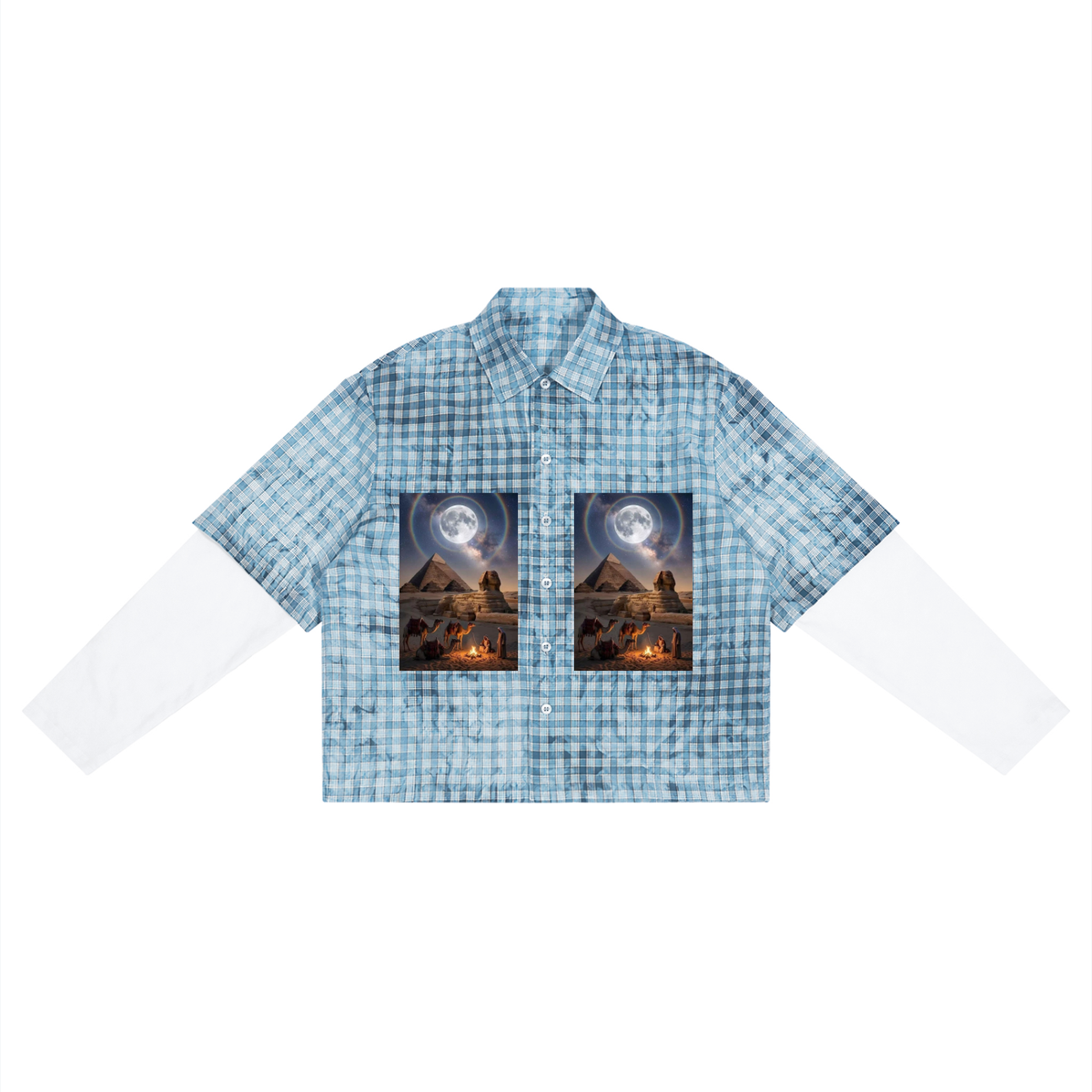 A short-sleeve button-up shirt with a light blue and white gingham pattern, featuring two rectangular graphic prints on the chest depicting a desert landscape under a full moon.