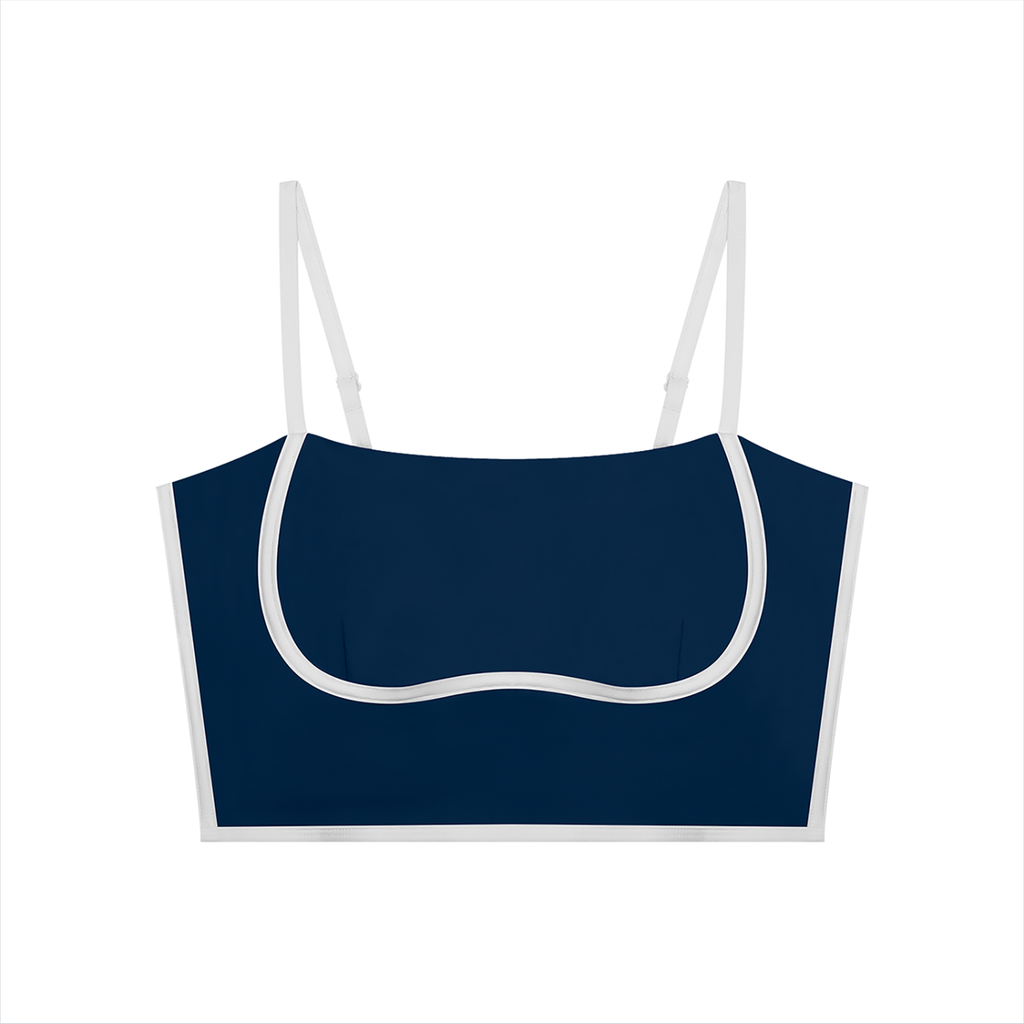 Navy blue crop top with thin white straps on a white background