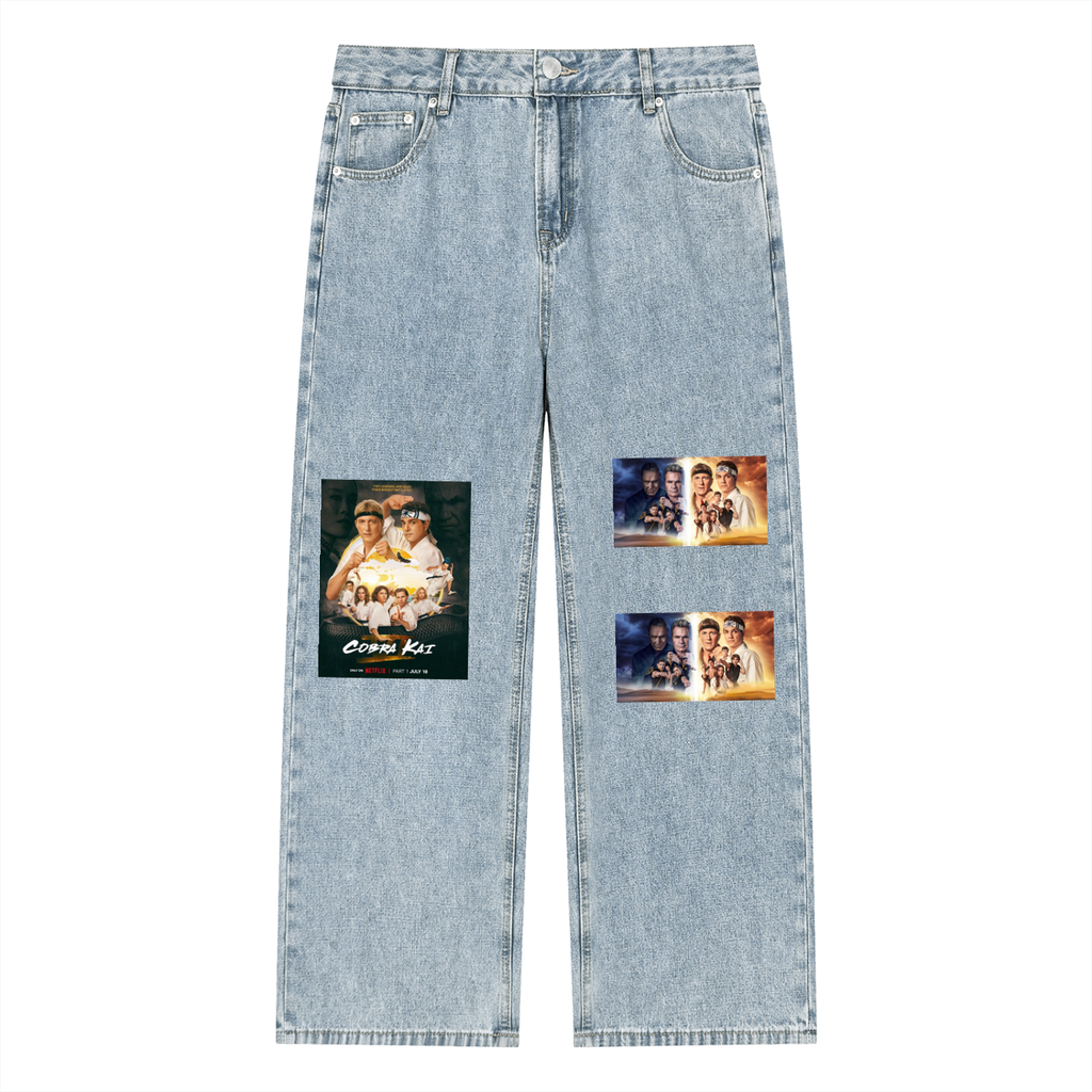 Light blue jeans with graphic patches on a white background