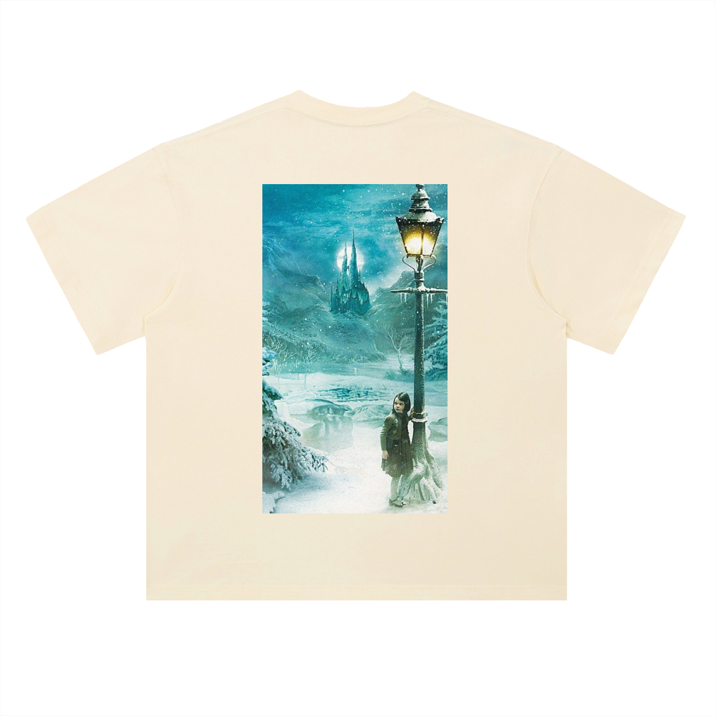 Beige t-shirt with a graphic of a person by a lamp post in a snowy scene on a white background