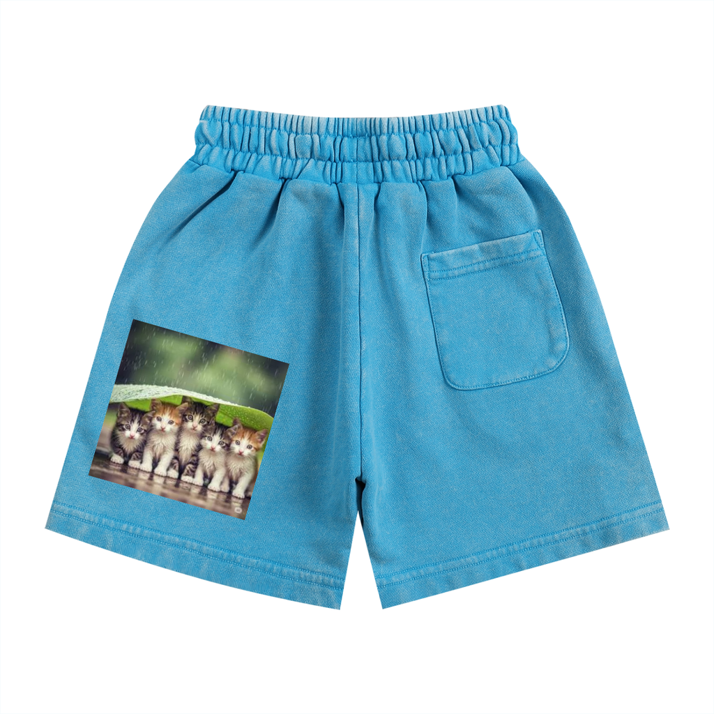 Blue shorts with a pocket featuring an image of four cats on a white background