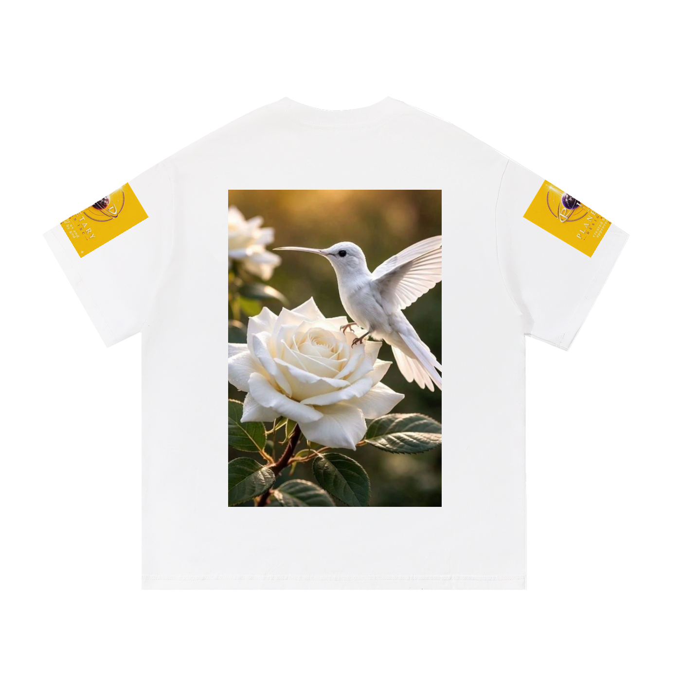 A white short-sleeve t-shirt with a large graphic print on the front showing a white hummingbird perched on a white rose. The t-shirt has yellow graphic patches on both sleeves.