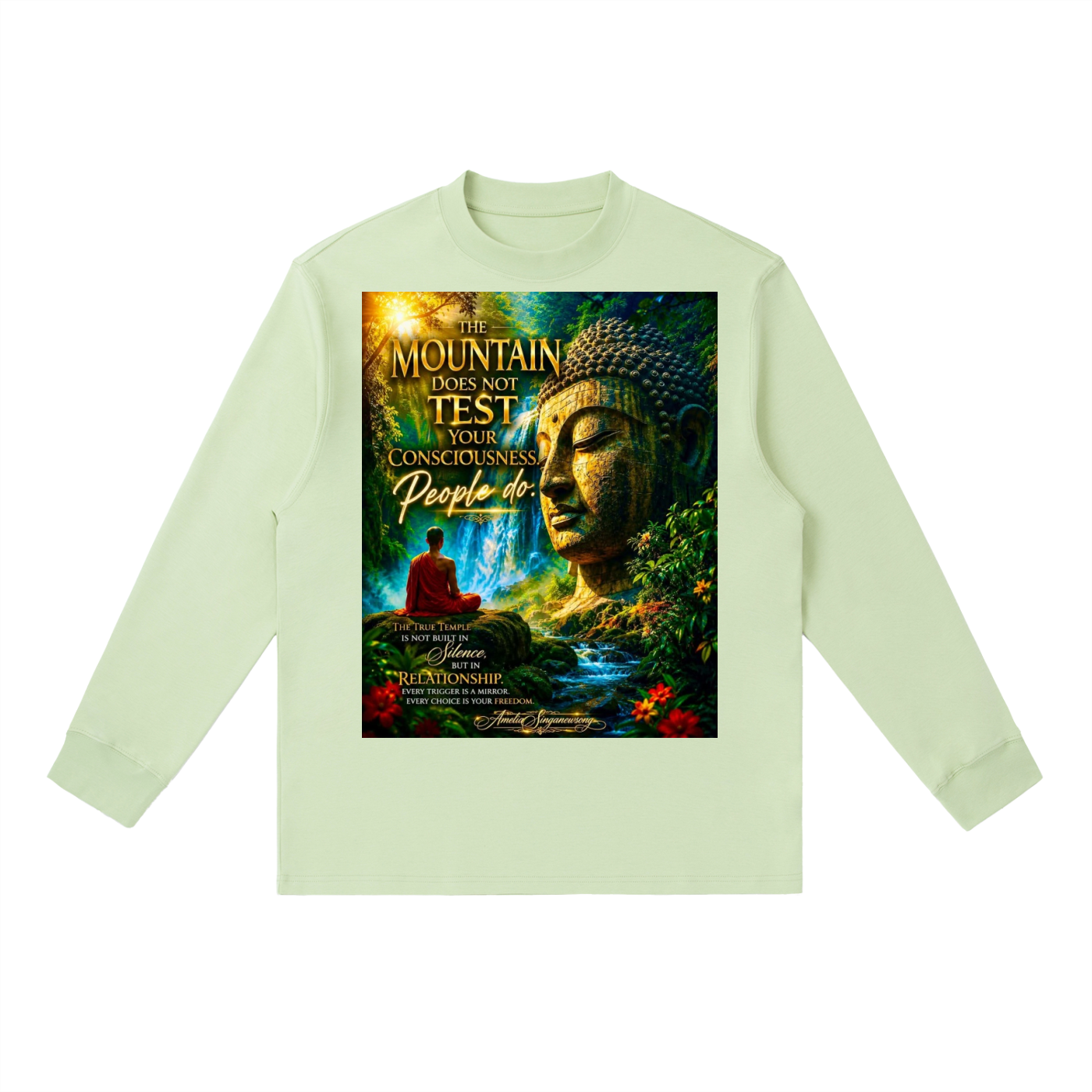 A light sage green long-sleeve t-shirt with a large, colorful graphic print on the front featuring a Buddha statue, a meditating figure, and the text 'THE MOUNTAIN DOES NOT TEST YOUR CONCEPTUALINESS People do'.