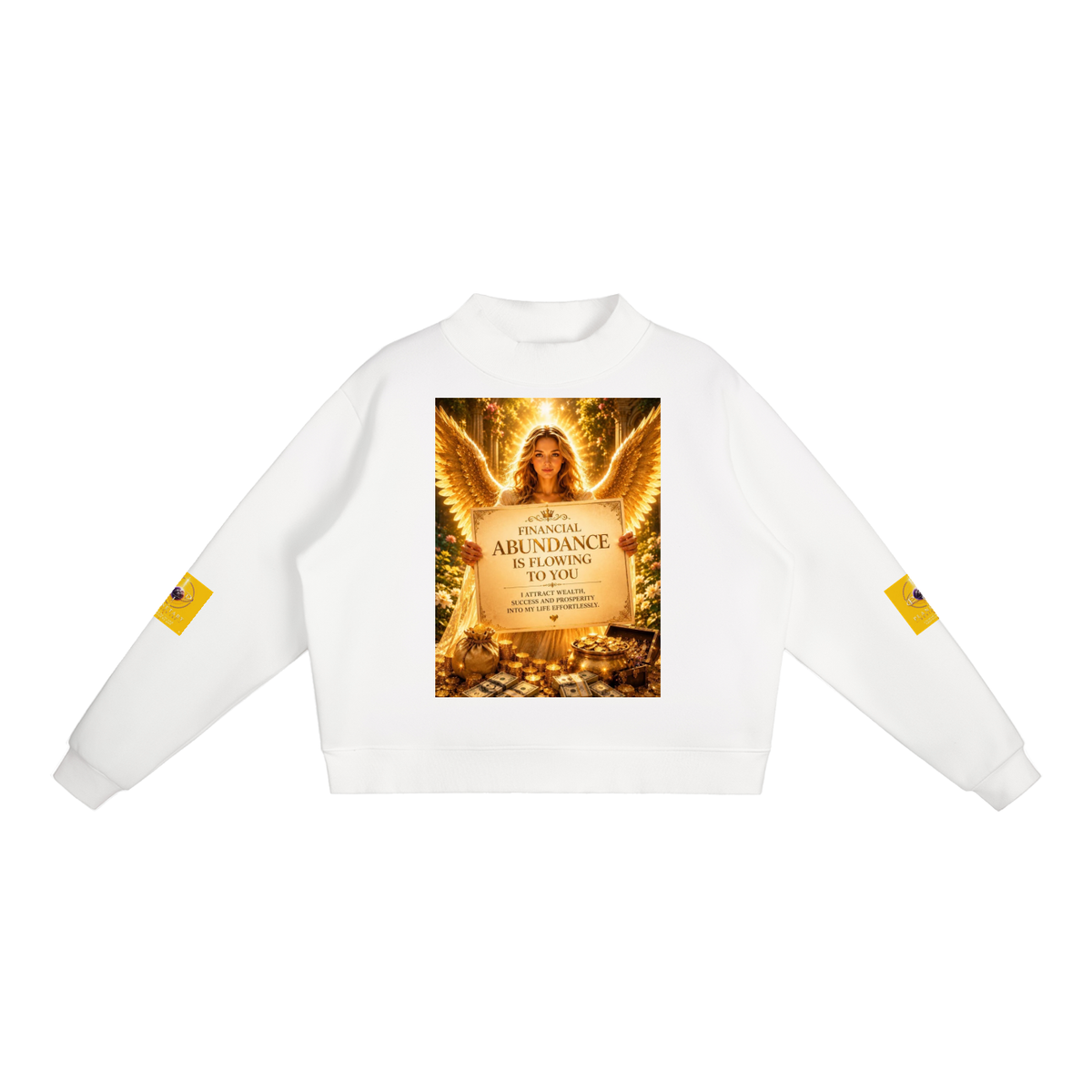 A white crewneck sweatshirt featuring a large graphic print on the front depicting an angel with wings and a sign that reads 'ABUNDANCE IS FLOWING IN YOU'. Each sleeve has a small yellow square graphic on it, set against a plain white background.