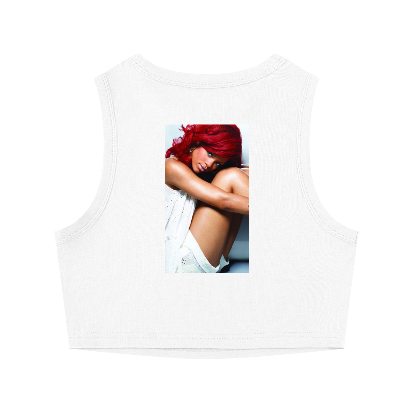White sleeveless top with a printed design of a woman with red hair on a white background