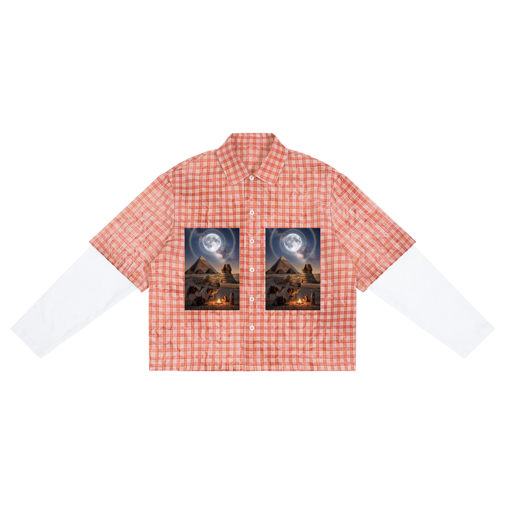 A short-sleeve button-up shirt with a red and white gingham pattern, featuring two rectangular desert landscape prints under a full moon on the chest, with white long sleeves extending from the sides, shown on a plain white background.