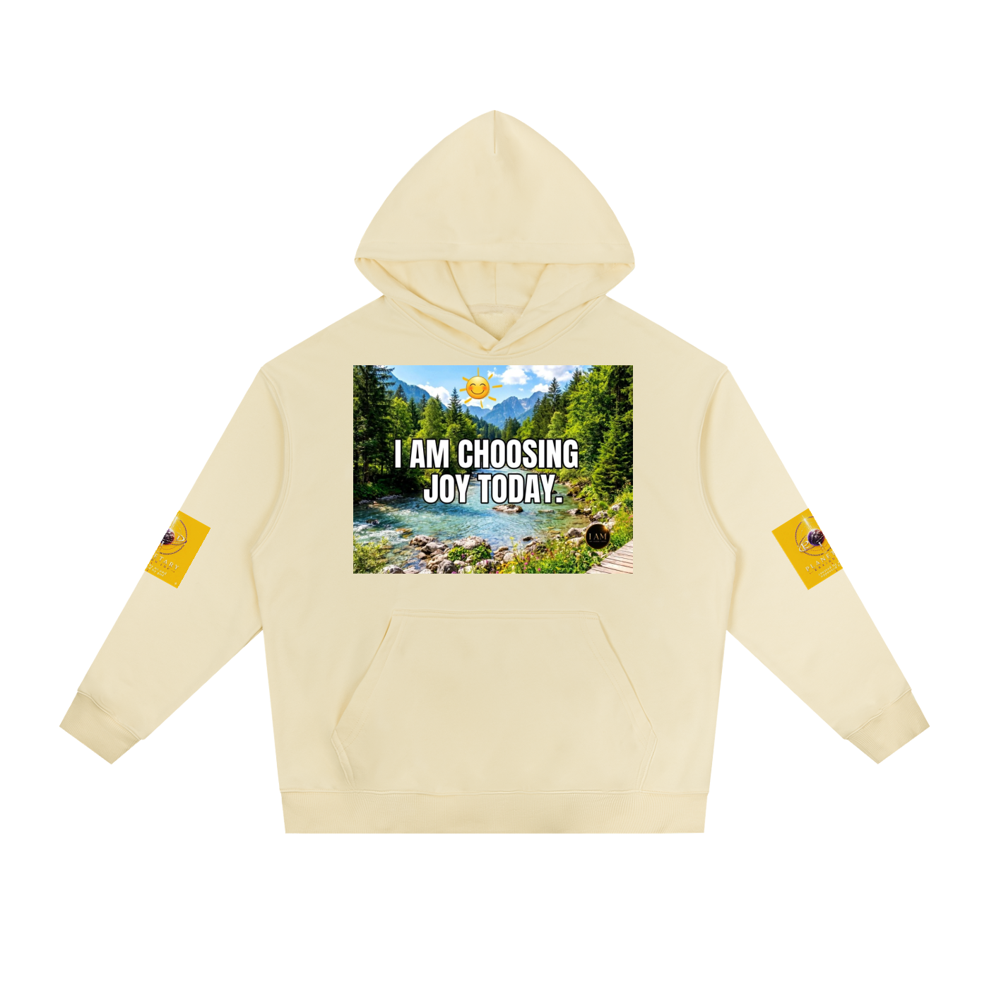 A cream-colored pullover hoodie featuring a central graphic print of a mountain river scene with the text 'I AM CHOOSING JOY TODAY.' and small yellow graphic patches on both sleeves, displayed on a solid white background.