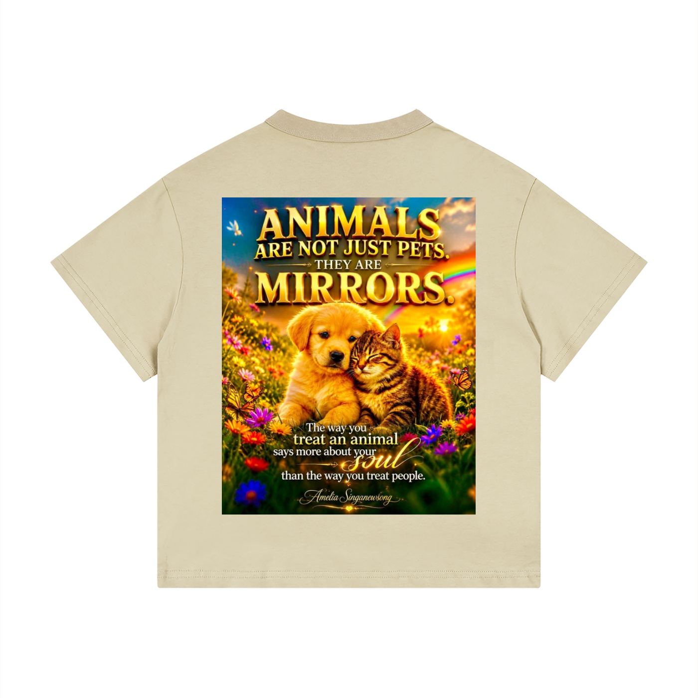 Beige t-shirt with a graphic of a dog and cat in a field with a motivational quote on a white background.