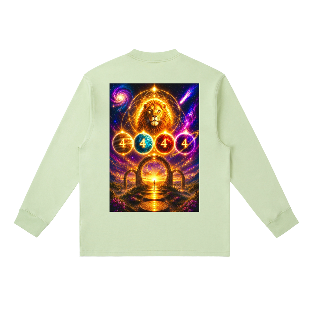 A light sage green long-sleeve t-shirt shown from the back, featuring a large, vibrant graphic print of a golden lion and cosmic elements with the number 4 repeated in circular emblems.