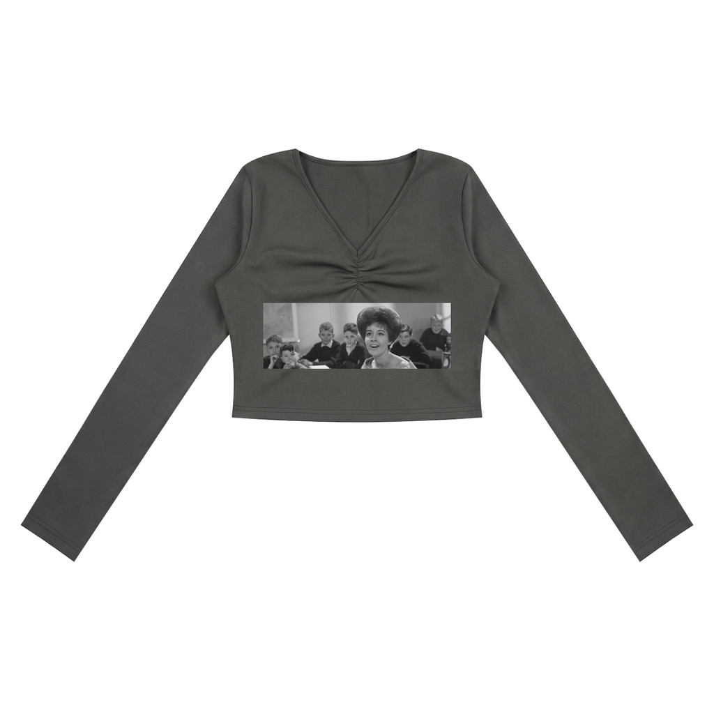 Dark gray long-sleeve crop top with a graphic print on a white background
