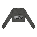 Dark gray long-sleeve crop top with a graphic print on a white background