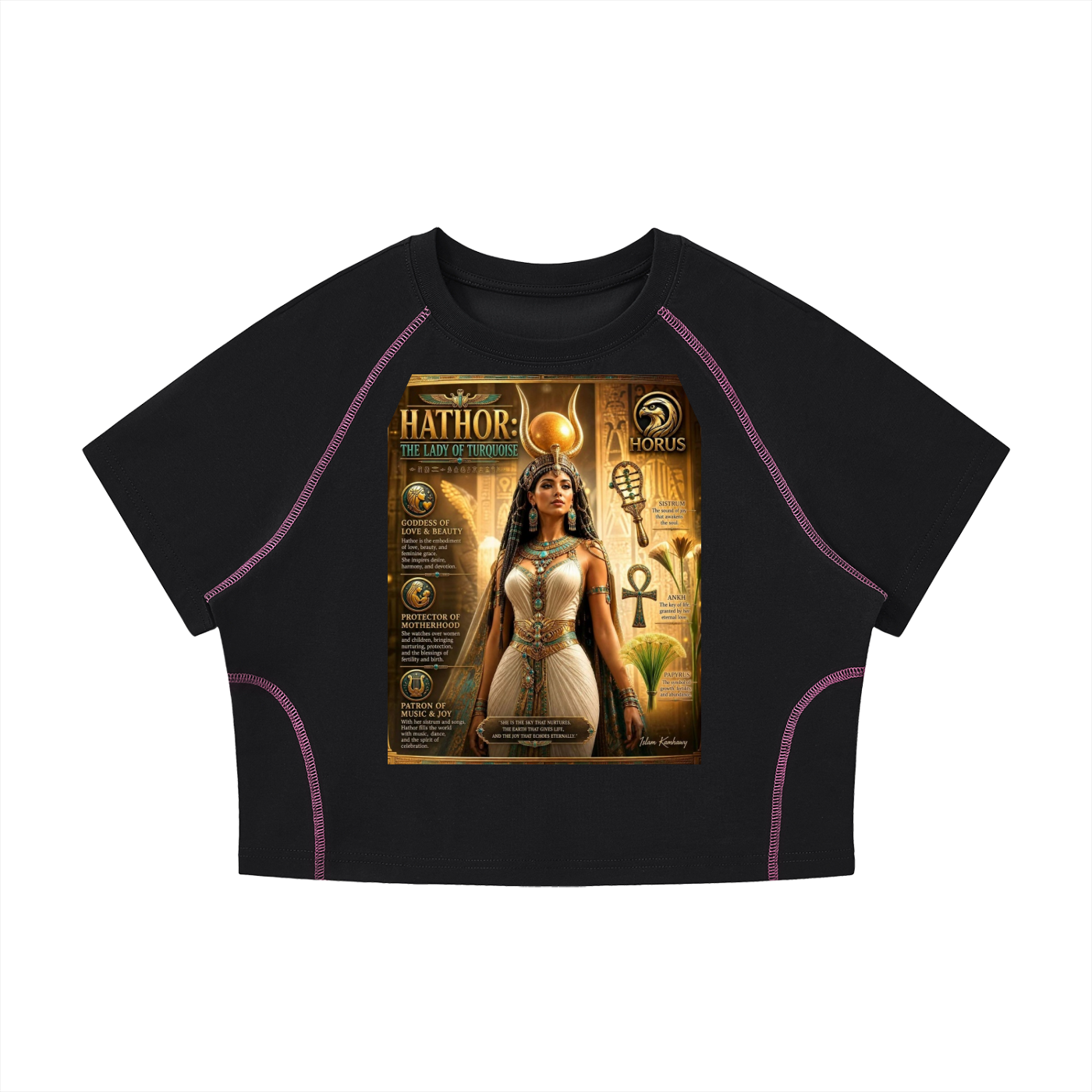 A black short-sleeve crop top with purple contrast stitching and a large graphic print on the front depicting an Egyptian-themed illustration labeled 'Hathor: The Goddess' and 'HORUS'.