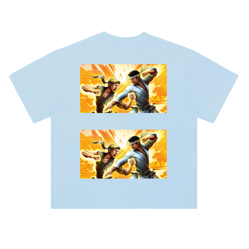 Light blue t-shirt with graphic of two characters in a fighting pose on a white background