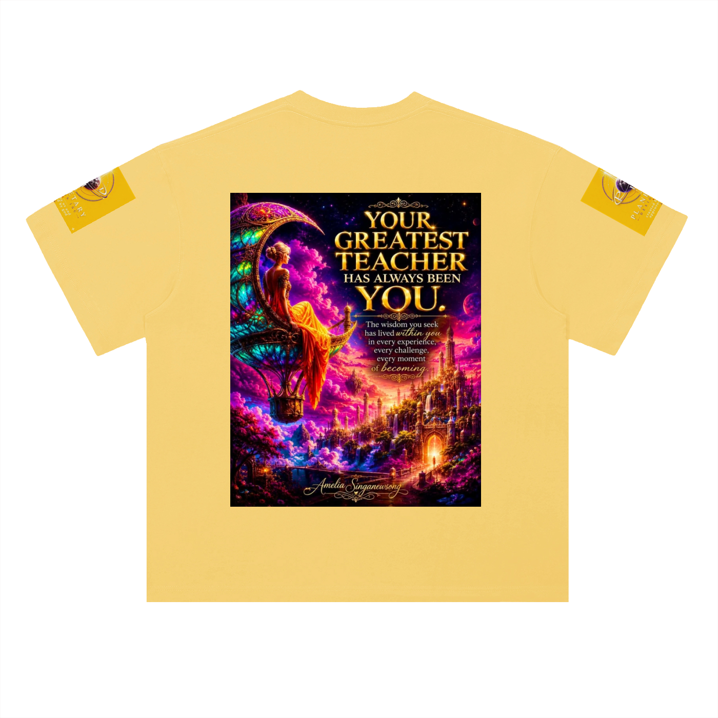 A pale yellow short-sleeve t-shirt with a large, colorful graphic print on the front. The graphic features a fantasy illustration of a woman on a crescent moon above a glowing city, with the text 'YOUR GREATEST TEACHER HAS ALWAYS BEEN YOU' in gold lettering.