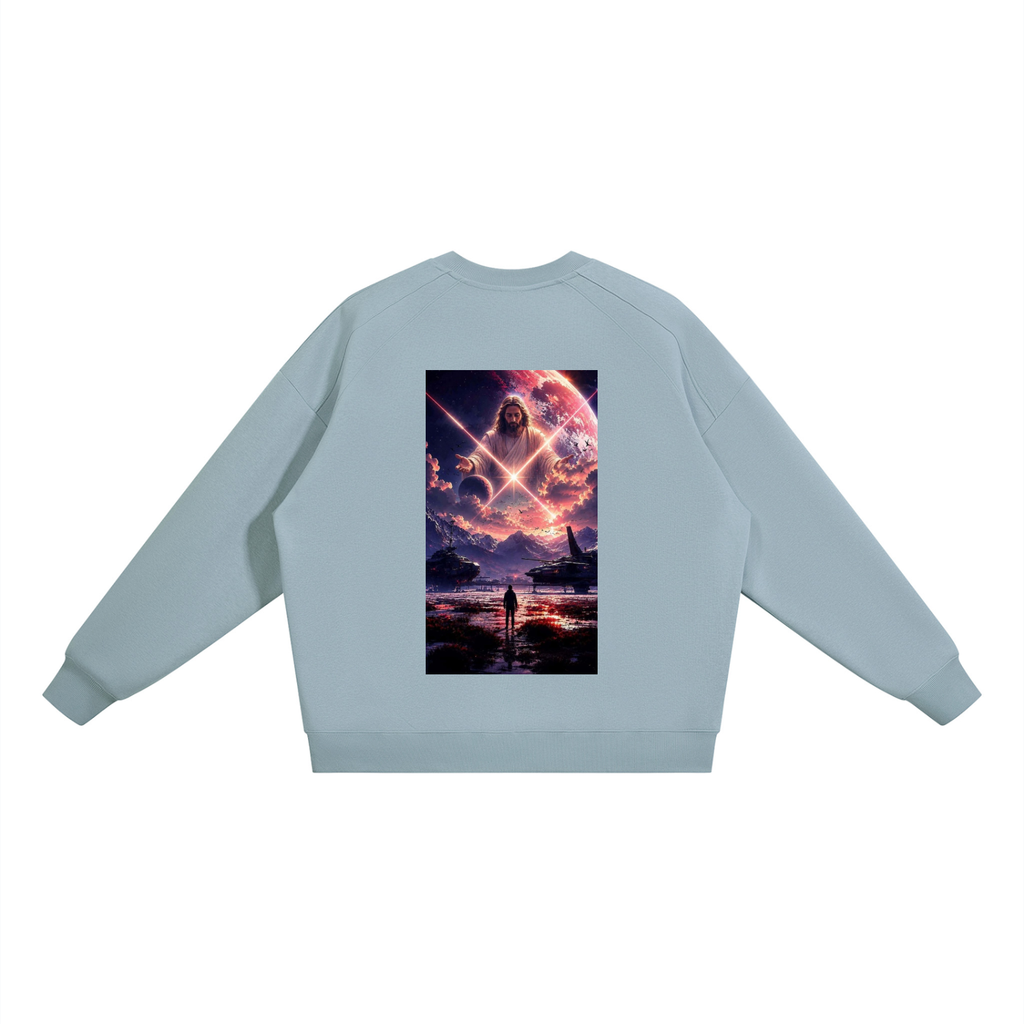 A light blue crewneck sweatshirt shown from the back, featuring a large rectangular graphic print of a cosmic scene with a glowing figure and a person standing in a reflective body of water.