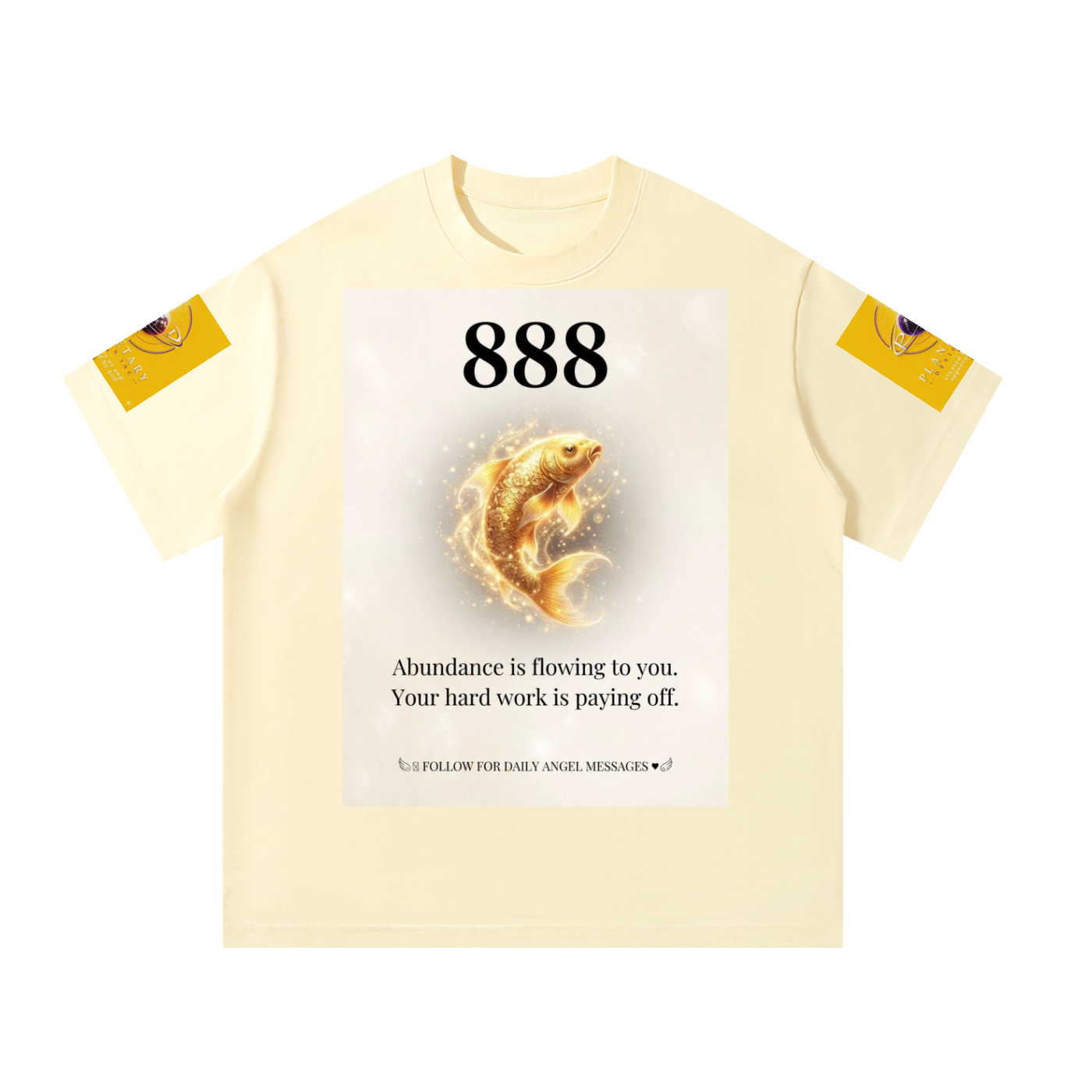 A cream-colored short-sleeve t-shirt with a central graphic print featuring a golden fish, the number '888', and a message about abundance. The sleeves have small yellow graphic patches.