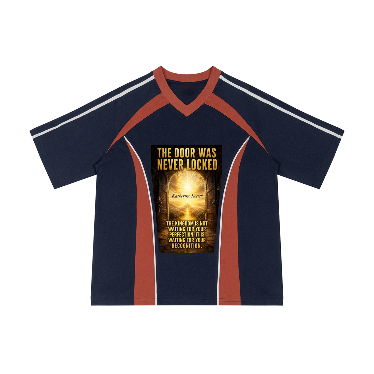 A navy blue short-sleeve V-neck t-shirt with rust red and white shoulder stripes, featuring a large graphic print on the front with the text 'THE DOOR WAS NEVER LOCKED' and a glowing golden keyhole design.