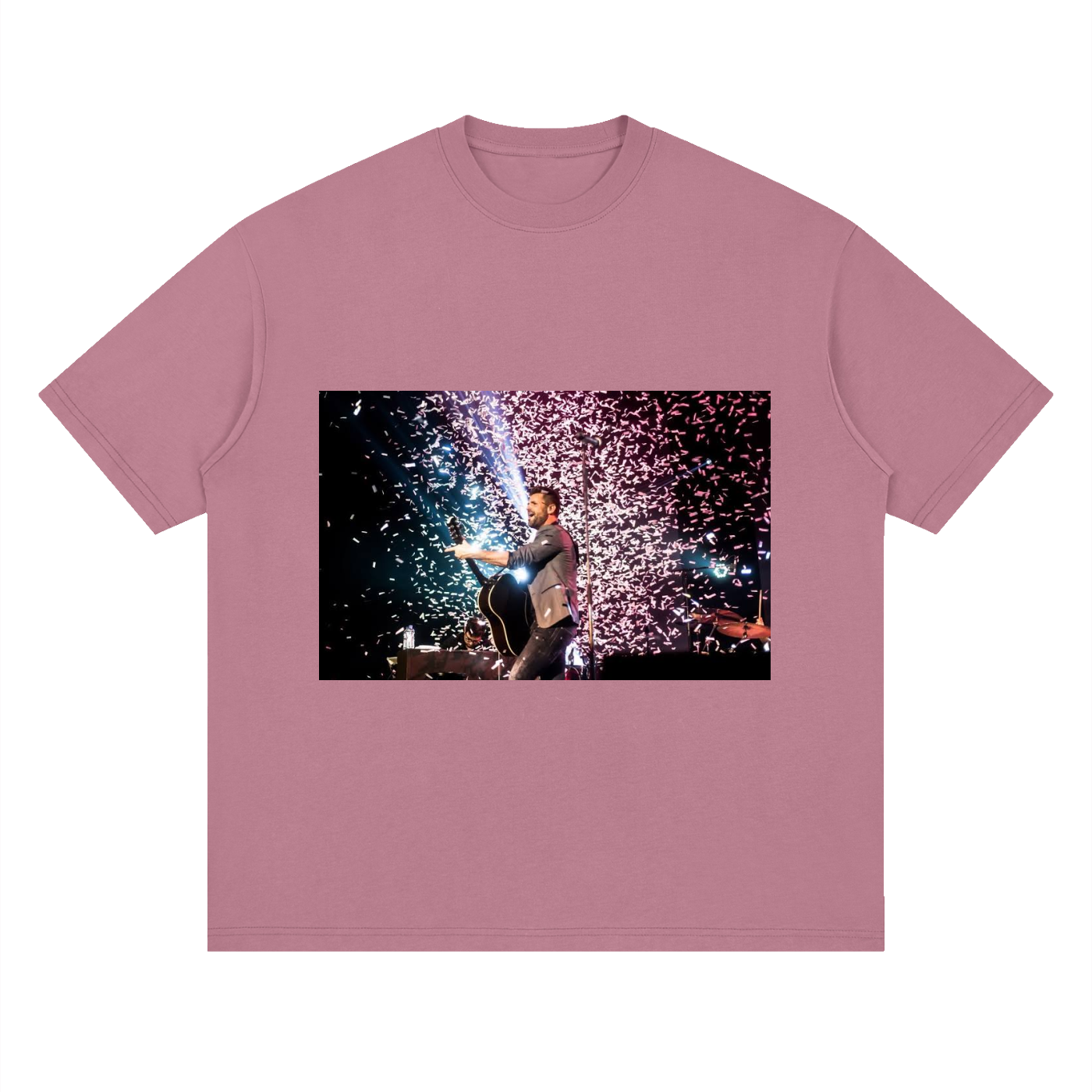 Pink t-shirt with a graphic of a person holding a sparkler against a fireworks background.